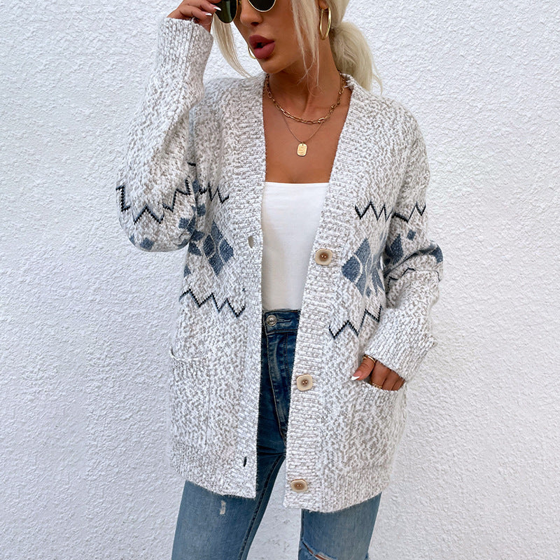 Women's single-breasted knit sweater with pockets, featuring snowflake pattern and V-neck design.