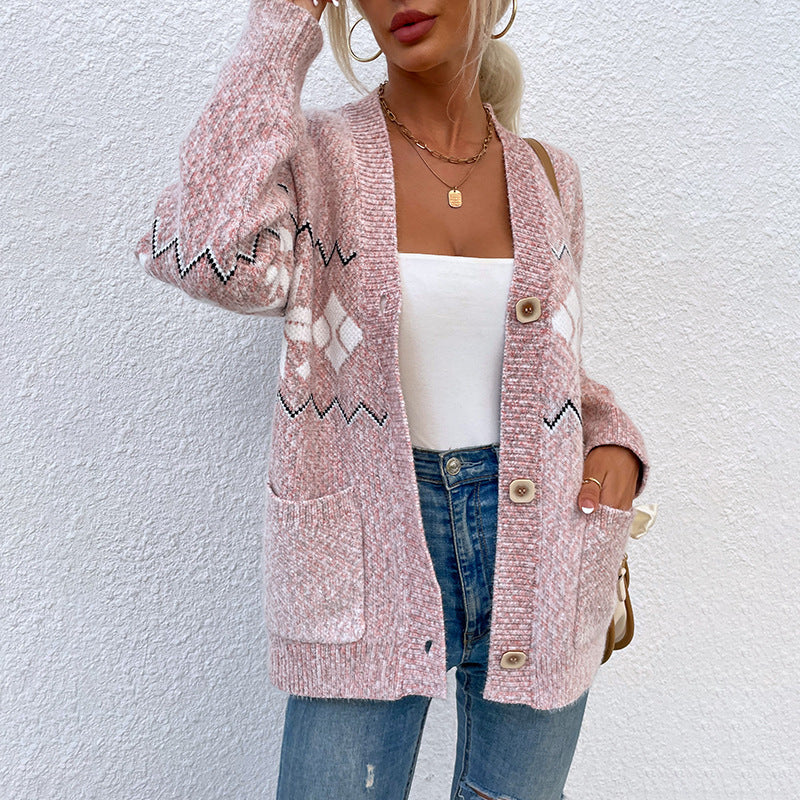 Single-breasted women's knit sweater with pockets, featuring a snowflake pattern in pink.
