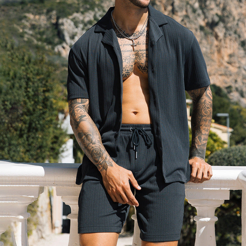 Men's two piece set with short sleeve shirt and shorts, comfortable and stylish design in black.
