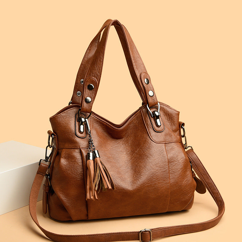 KLASSISCHE Tasche aus gewaschenem Schaffell mit Quastenstruktur