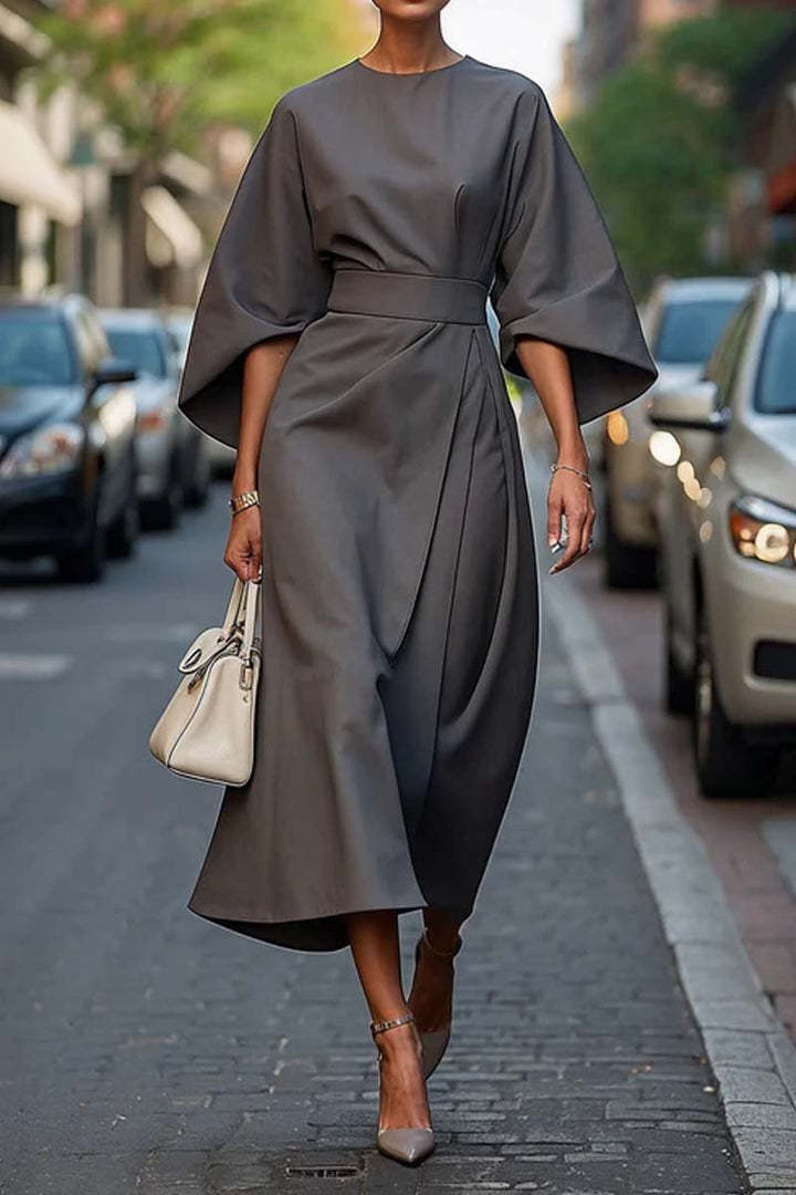 Loose batwing sleeve dress in street fashion style with belt, polyester material.