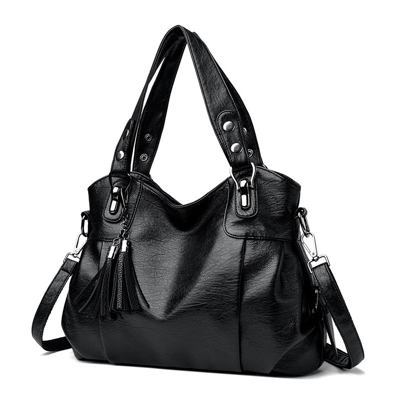 KLASSISCHE Tasche aus gewaschenem Schaffell mit Quastenstruktur