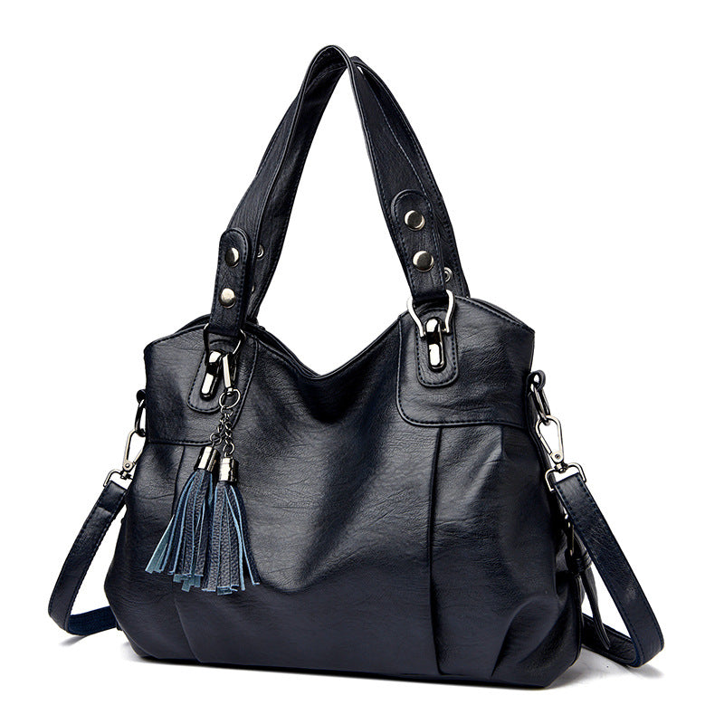 KLASSISCHE Tasche aus gewaschenem Schaffell mit Quastenstruktur