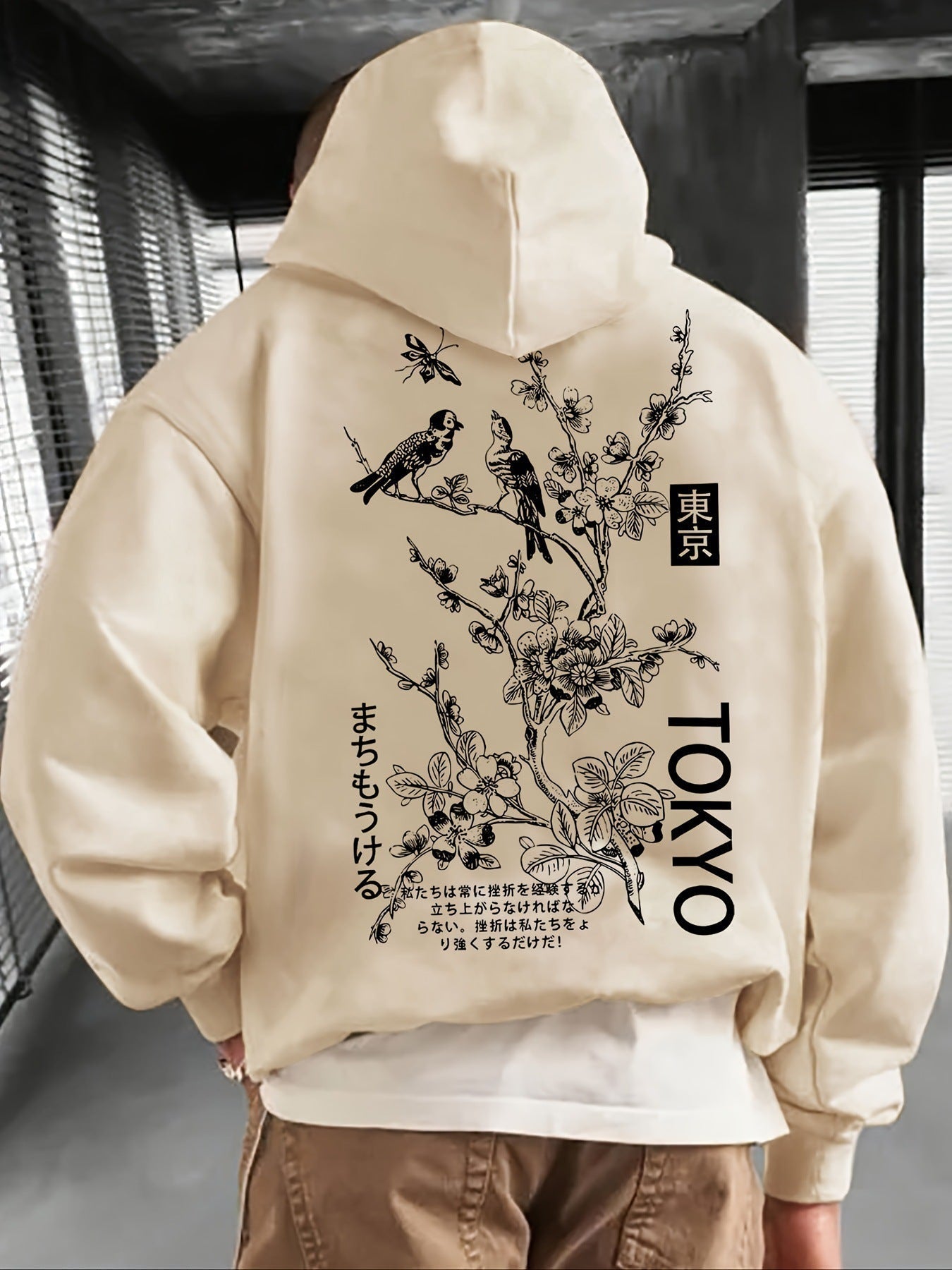 Apricot polyester casual fashion hoodie with floral and bird design on back.