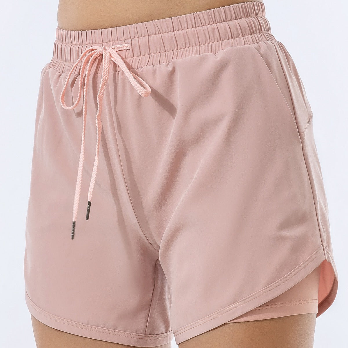 Summer fashion loose pink sports shorts for women, quick-drying polyester fabric.