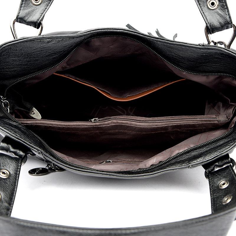 KLASSISCHE Tasche aus gewaschenem Schaffell mit Quastenstruktur