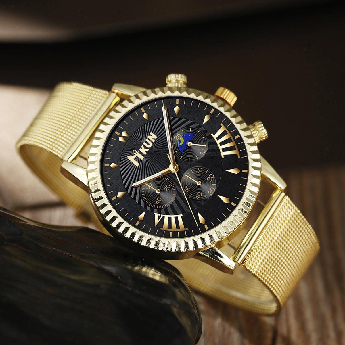 Stylish gold and black sports watch with stainless steel band and unique dial design.