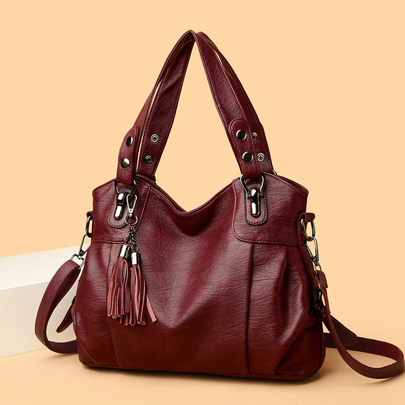 KLASSISCHE Tasche aus gewaschenem Schaffell mit Quastenstruktur