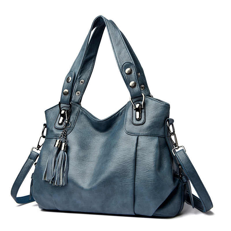 KLASSISCHE Tasche aus gewaschenem Schaffell mit Quastenstruktur