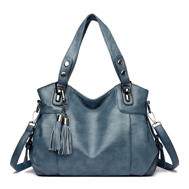 KLASSISCHE Tasche aus gewaschenem Schaffell mit Quastenstruktur