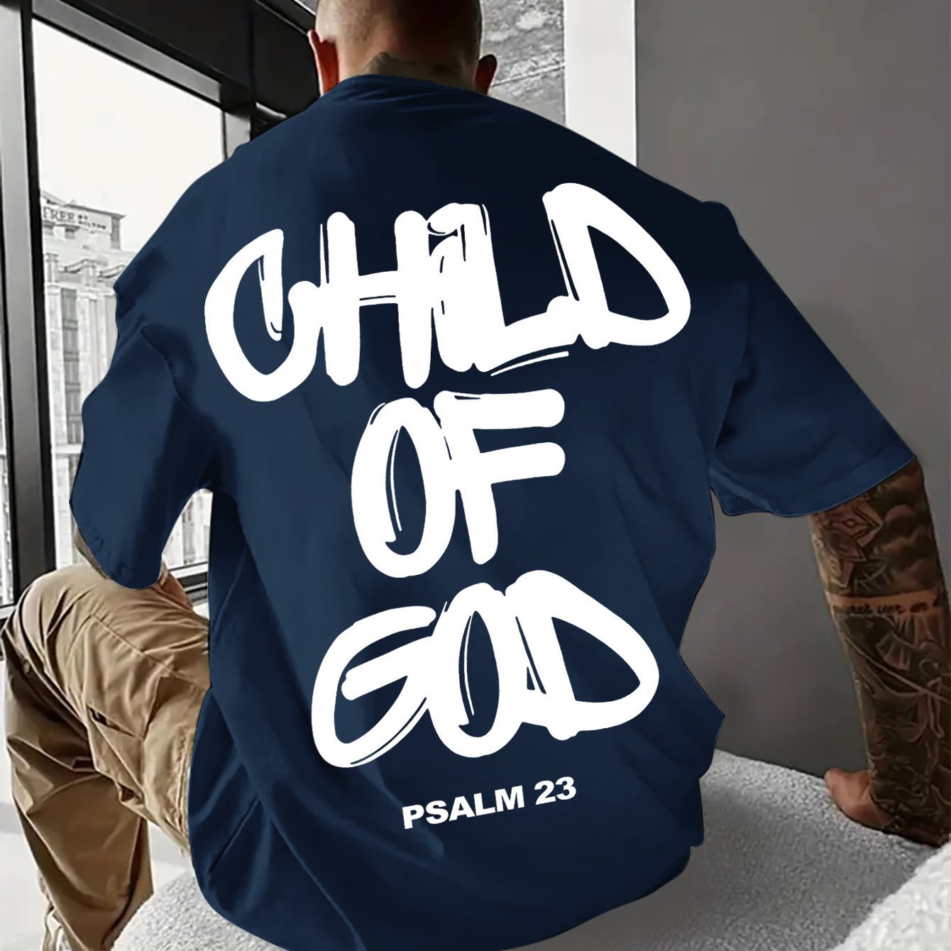 Casual and comfortable men's short sleeve shirt with white graphic text on the back.