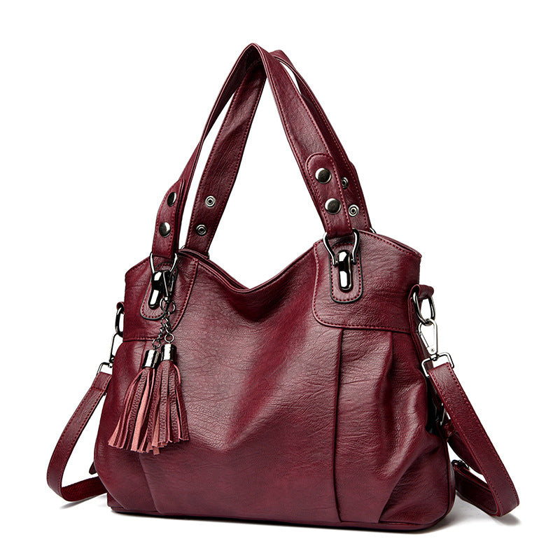 KLASSISCHE Tasche aus gewaschenem Schaffell mit Quastenstruktur
