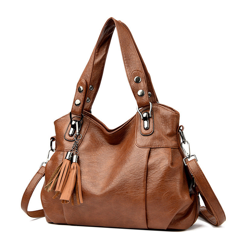 KLASSISCHE Tasche aus gewaschenem Schaffell mit Quastenstruktur