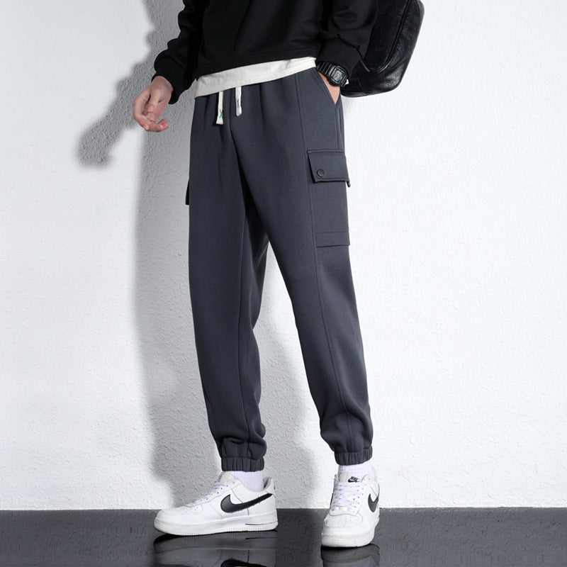 Men's dark gray knitted cotton casual sports trousers with drawstring waist and side pocket.