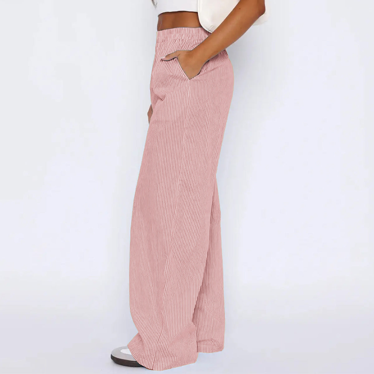 Striped trousers with pockets, loose fit, high-waisted, comfortable style.