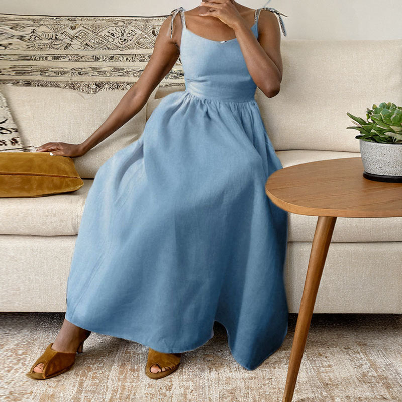 Summer V-neck high waist long dress in blue, sleeveless design, showcased indoors with stylish modern decor.