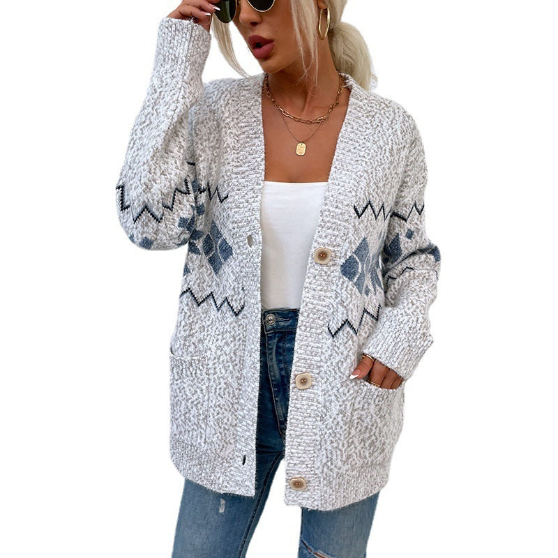 Single-breasted pocket women's knit sweater with snowflake pattern and V-neck design.
