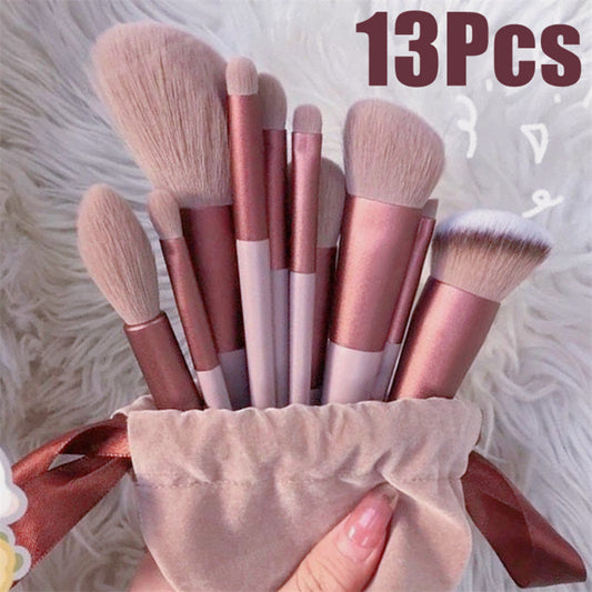 13Pcs Makeup Brush Set with pink handles and soft bristles in a cloth bag.