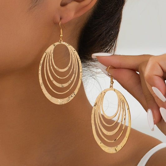 European Fashion Elegant 3 Layer Hollow Earrings with geometric design in golden hue.