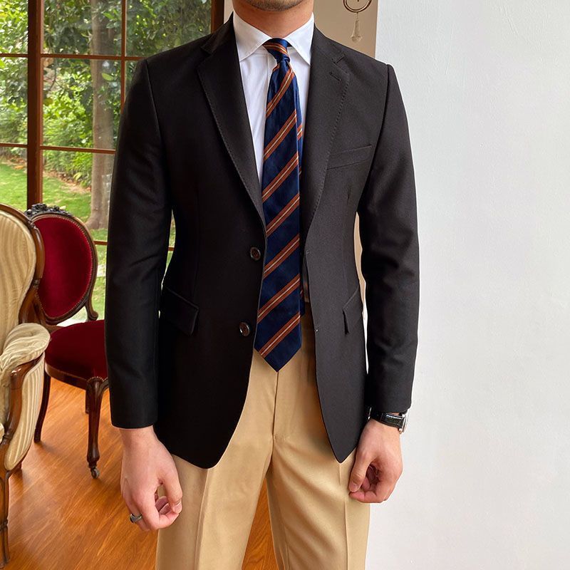 Casual Business Double Breasted Suit Jacket in black, worn by a person in a stylish setting.