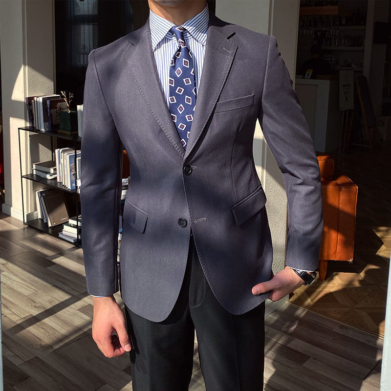 Casual business all-match double-breasted suit jacket in gray, worn for a stylish look.