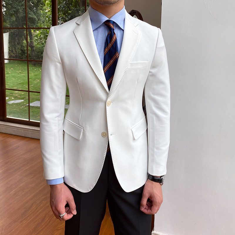 Casual business all-match double-breasted suit jacket in white, worn by model indoors.