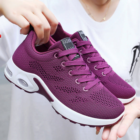 Women's purple breathable air cushion running shoes with mesh upper.