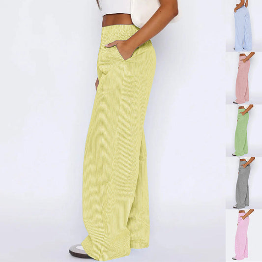 Striped high-waist trousers with pockets in various colors.