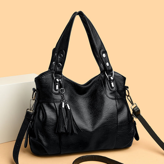 KLASSISCHE Tasche aus gewaschenem Schaffell mit Quastenstruktur