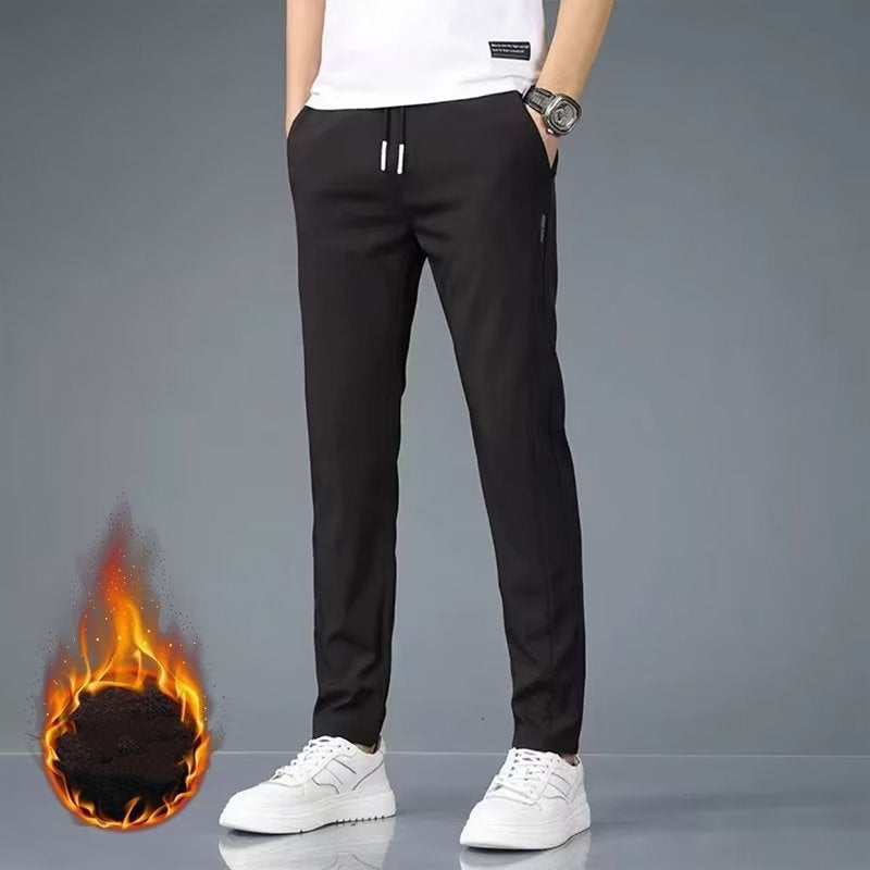 Men's plus size fashion straight pants in black with white sneakers and casual fit.