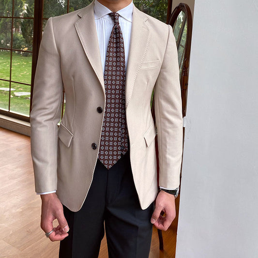 Casual business all-match double breasted suit jacket in beige, worn indoors.