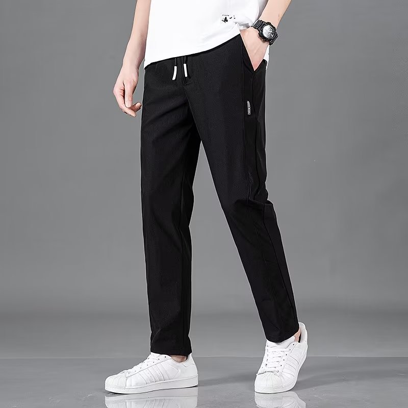 Men's plus size fashion straight pants in black with elastic waist, suitable for casual wear.