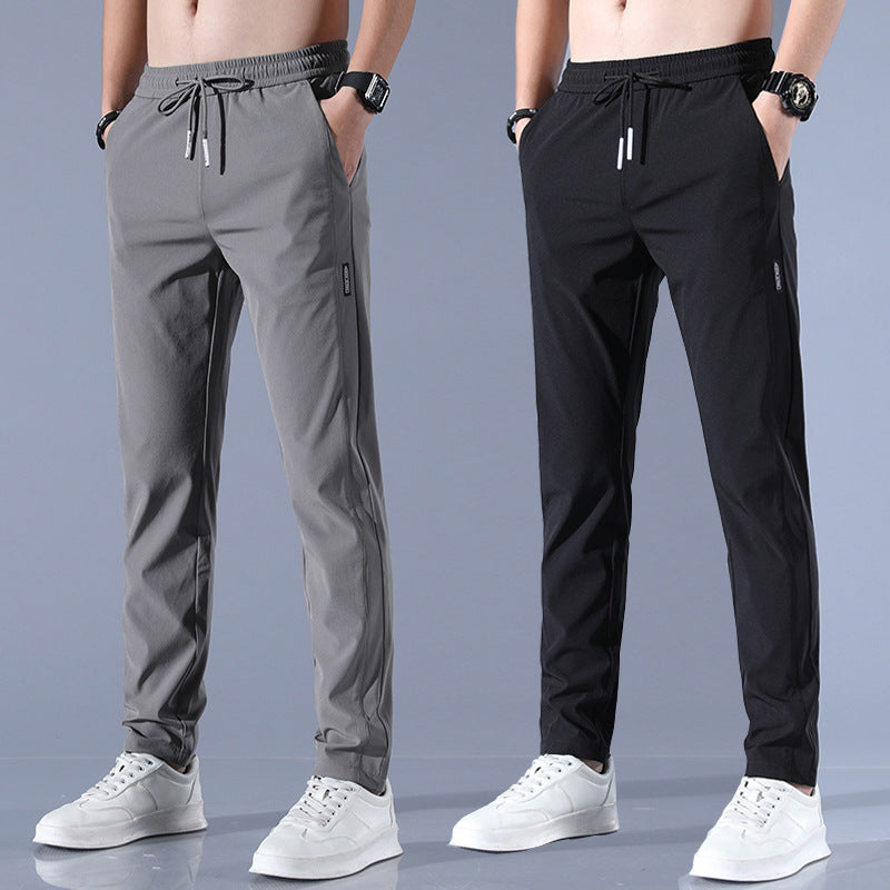 Men's plus size fashion straight pants in dark gray and black, modeled with a slim fit and elastic waistband, styled for casual wear.
