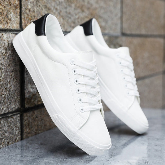 Men's casual multicolor sneakers with a white upper, black heel accent, and front lace-up design.