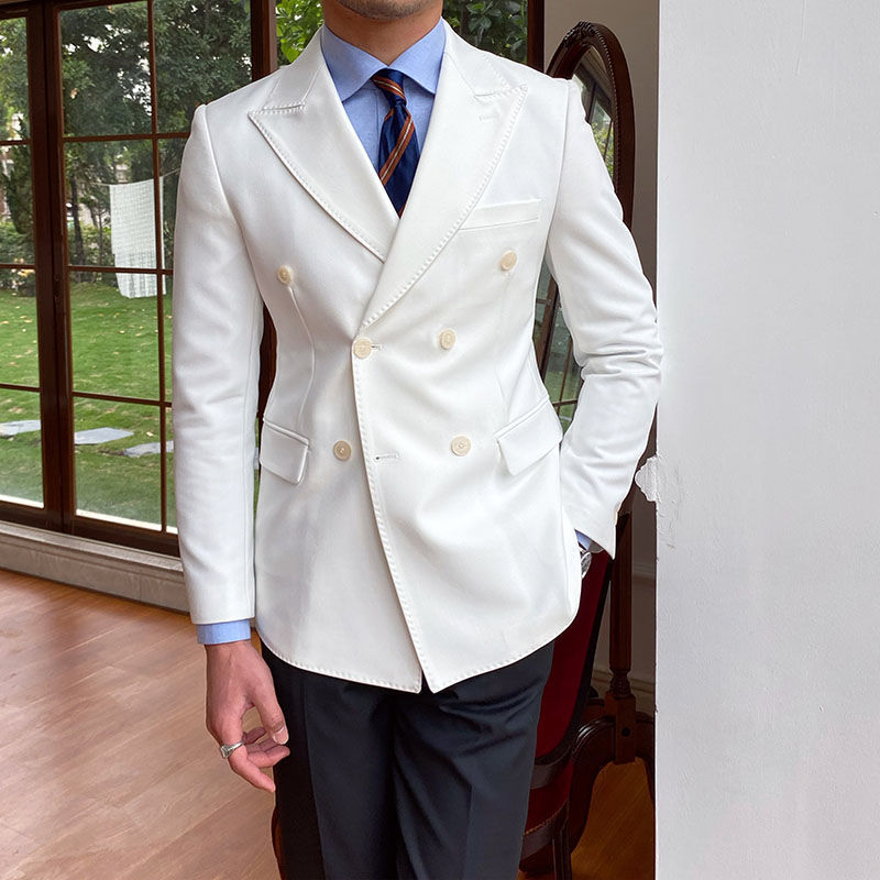 Casual business all-match double breasted suit jacket in white, displayed indoors.